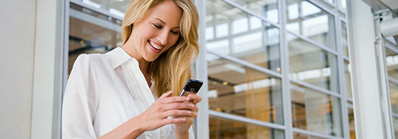 Woman smiling at phone