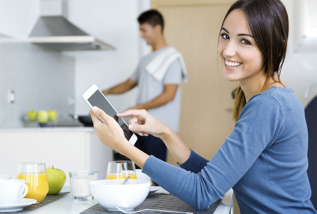 Woman with tablet in the kitchen